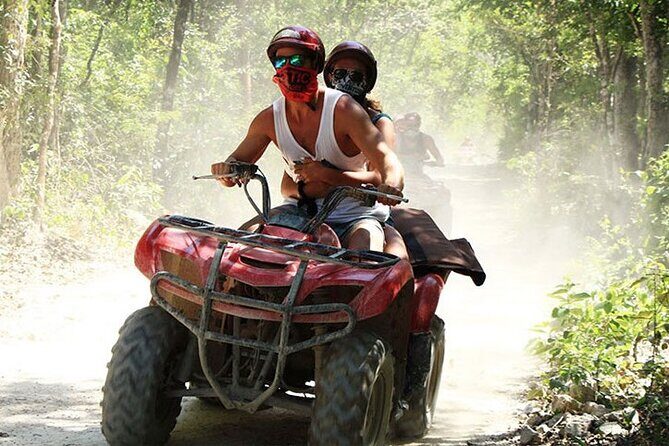 ATV Cenote and Zipline Adventure from Tulum - ATV riding through jungle roots, rocks, and ups-and-downs
