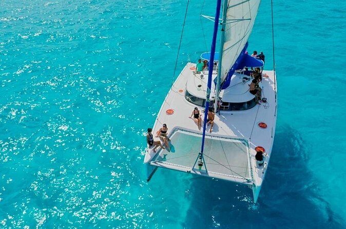 Catamaran Tour to Isla Mujeres Snorkeling with Buffet and Open Bar - Playa Norte Snorkeling: One Hour Over the Reefs