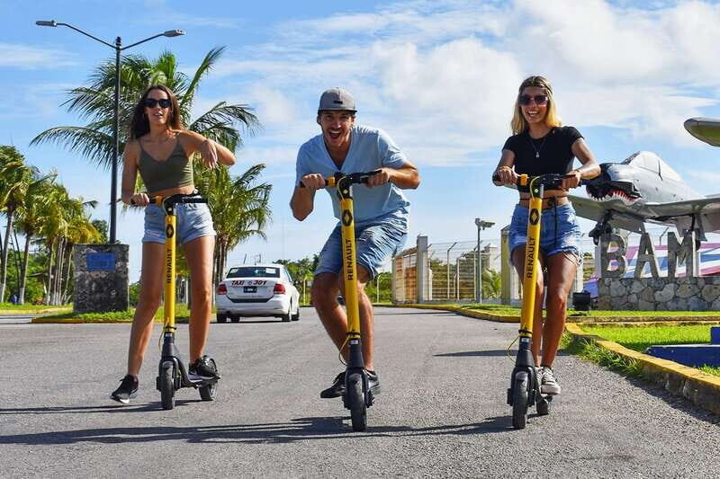 Cozumel: Clear Boat and Electric Scooter Ride - Electric scooters, fast photos, and a WWII air-base lesson