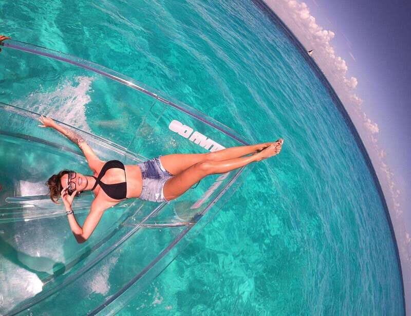 Explore the sea of cozumel in a transprent boat with drinks and snorkel. - From Envatours Cozumel to the North Side: How the Tour Starts