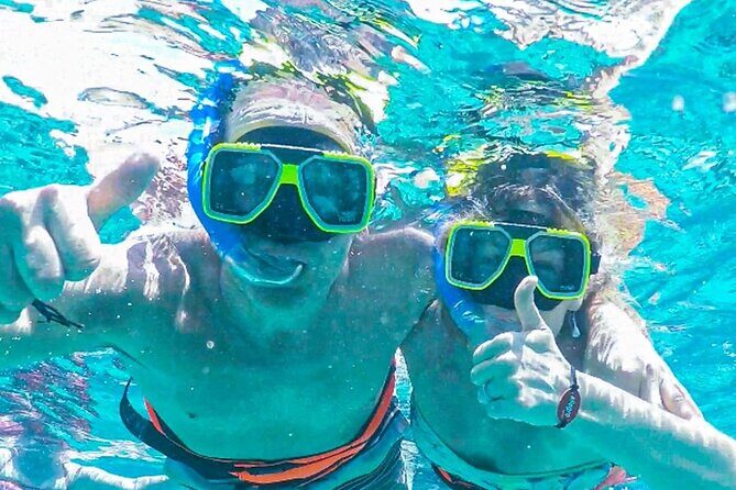 Luxury Cozumel Catamaran: Snorkel, Beach Club & Relaxation - At Sea: 65-Foot Catamaran, Certified Guides, and Snorkeling